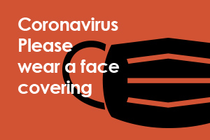 Graphic of a black face covering on a orange background, with the words Coronavirus, please wear a face covering
