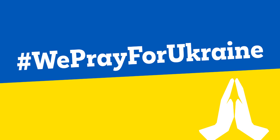 Blue and yellow background with words #WePrayForUkraine and praying hands in white bottom right